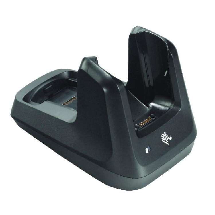 A Zebra CRD-MC33-2SUCHG-01 two-slot cradle, empty: a sloped bay on the left
                  for the terminal and an upright bay on the right for a spare battery.